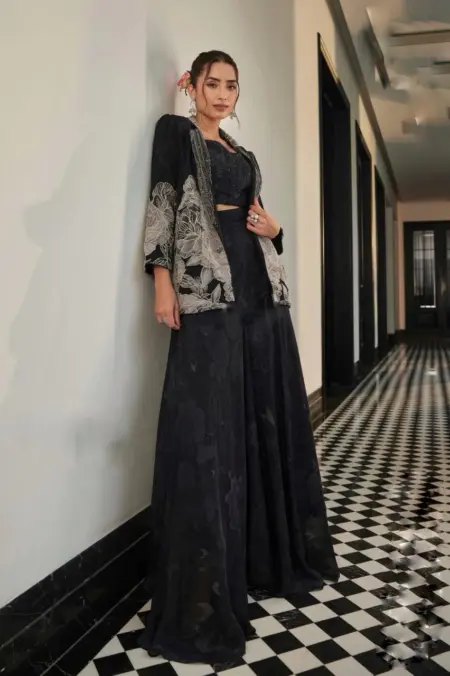 Embroidered black jacket with crop top and lehenga set