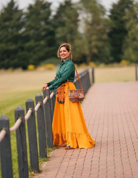 Green silk shirt with mustard skirt